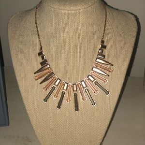 Kendra Scott rose gold with olive accent stone.